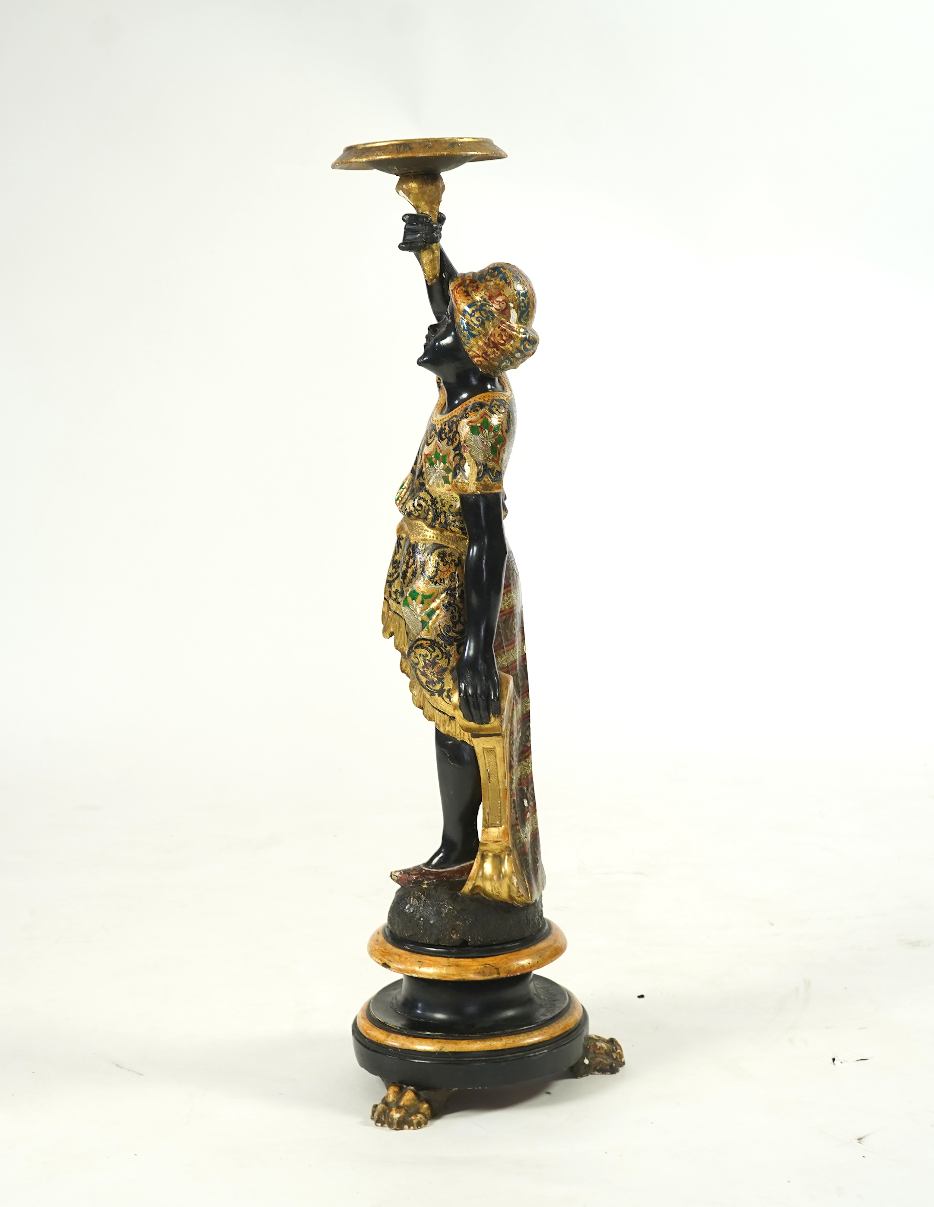 A 19th century Italian carved wood and composition polychrome painted blackamoor torchere